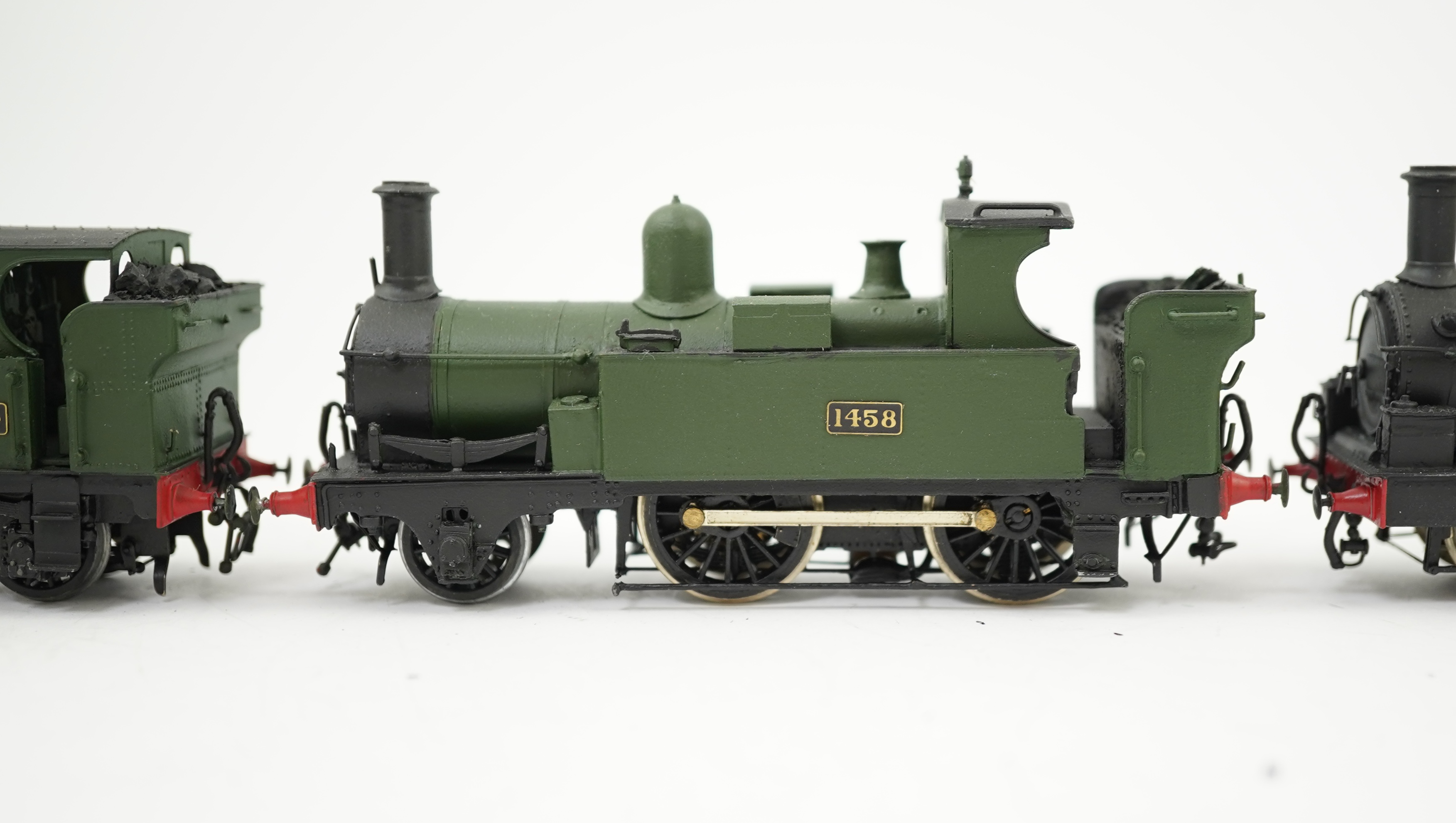 Four 00 gauge kit built GWR tank locomotives, three brass and white metal; a 14xx class 2-4-0T, 1458, together with an 517 class 0-4-2T, 574, and a 633 class 0-4-2T, 633, plus a plastic/resin and metal 46xx class 4-4-2T,